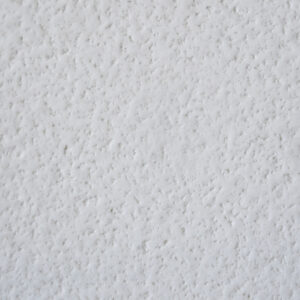 Primer plano de una superficie de pared con textura blanca Blanco Zeus Extreme.